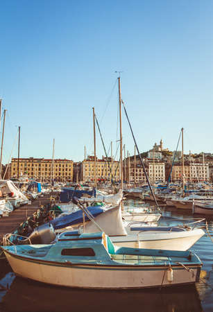 Boats and yachts moored at sunset in Old Port of Marseille, Provence, Franceの写真素材