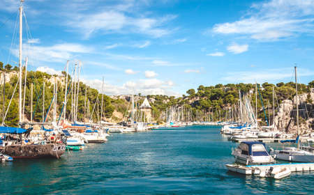 Harbour with yachts and boats and small tower in rocky inlet of Calanques in Cassis near Marseille, Franceのeditorial素材