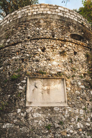 Old stone tower with memorial plate in Castle Hill park in Nice, Cote dAzur, Franceの写真素材