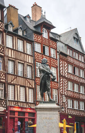 RENNES, FRANCE - OCTOBER 4, 2009: Statue of Jean Leperdit, Mayor of Rennes in 1794-1795, against historic beautiful half-timbered housesのeditorial素材