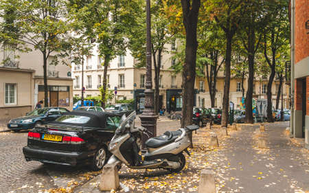 PARIS, FRANCE - OCTOBER 1, 2009: Beautiful and cosy street covered with autumn leaves on Montmartre hillのeditorial素材