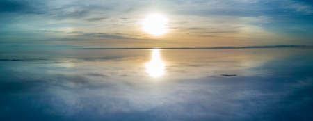sunrise over an infinite horizonの写真素材
