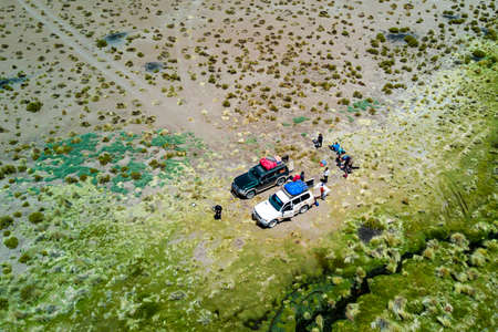 Traveling to Uyuni salt flats along the bolivian "altiplano" an amazing journey from Chile to Bolivia, an awesome AWD along the Andes mountainsの写真素材