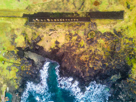 An aerial view over Ahu Tongariki, the most amazing Ahu platform on Easter Island.の写真素材