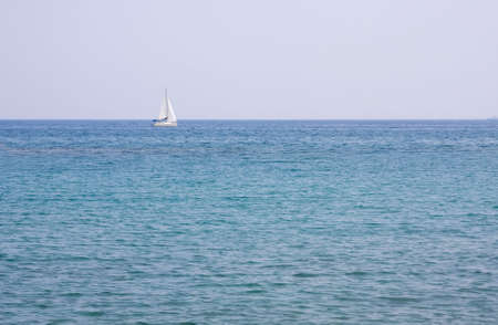 White sail in the seaの写真素材