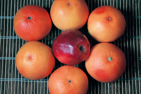 Fruits closeup, juicy orange grapefruit and applesの写真素材