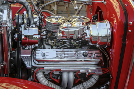 Chrome-plated retro car engine close-up.の写真素材