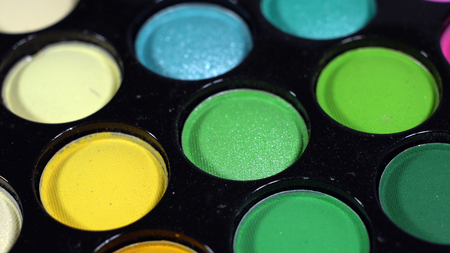 Multicolored bright shiny eye shadow. The pallet rotatesの写真素材