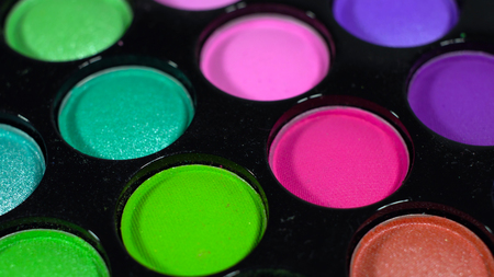 Multicolored bright shiny eye shadow. The pallet rotatesの写真素材