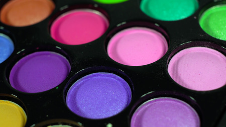 Multicolored bright shiny eye shadow. The pallet rotatesの写真素材