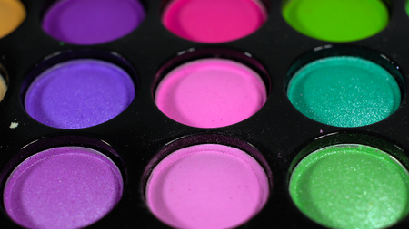 Multicolored bright shiny eye shadow. The pallet rotatesの写真素材