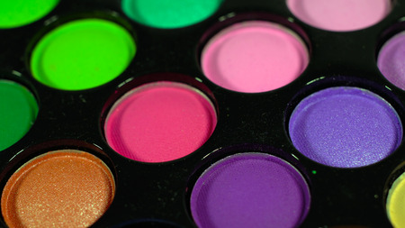Multicolored bright shiny eye shadow. The pallet rotatesの写真素材