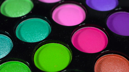Multicolored bright shiny eye shadow. The pallet rotatesの写真素材