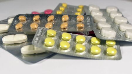 a set of various tablets and capsules in blisters.の写真素材