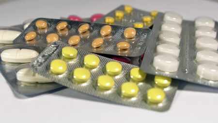 a set of various tablets and capsules in blisters.の写真素材
