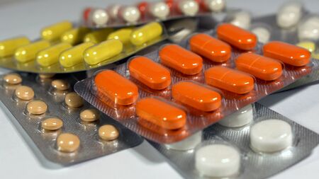 a set of various tablets and capsules in blisters.の写真素材