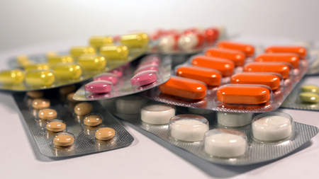 a set of various tablets and capsules in blisters.の写真素材