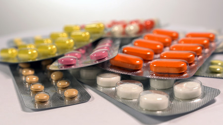 a set of various tablets and capsules in blisters.の写真素材