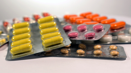 a set of various tablets and capsules in blisters.の写真素材