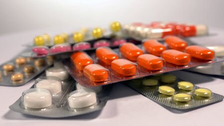 a set of various tablets and capsules in blisters.の写真素材
