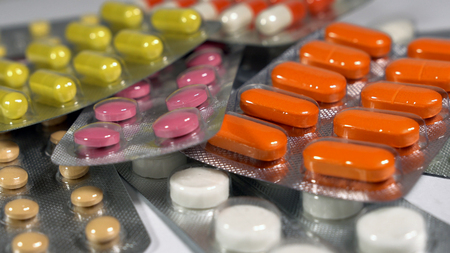 a set of various tablets and capsules in blisters.の写真素材