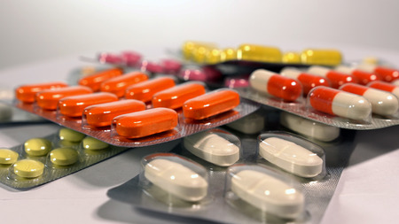 a set of various tablets and capsules in blisters.の写真素材