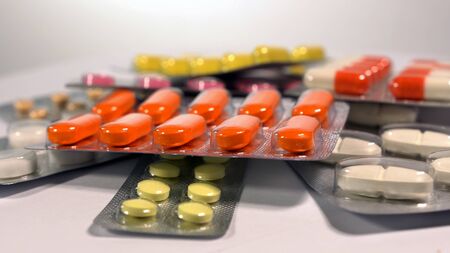 a set of various tablets and capsules in blisters.の写真素材