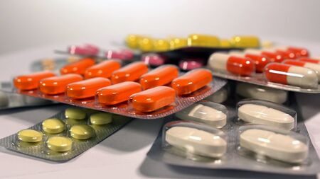 a set of various tablets and capsules in blisters.の写真素材