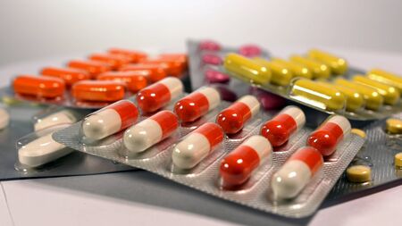a set of various tablets and capsules in blisters.の写真素材