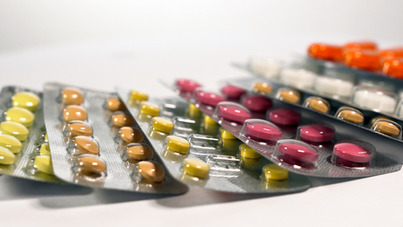 a set of various tablets and capsules in blisters.の写真素材