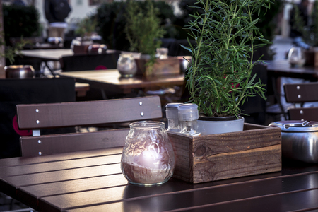 Table and items in a cozy European cafe close-up.の写真素材