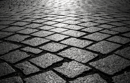 Background of cobblestones on the pavement in the old town.の写真素材