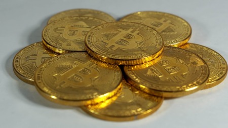 Rotating Stack Of Gold Bitcoins On Turntable.の写真素材