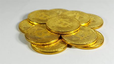 Rotating Stack Of Gold Bitcoins On Turntable.の写真素材