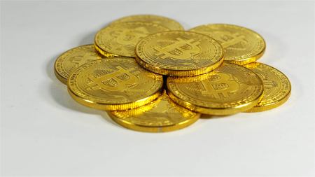 Rotating Stack Of Gold Bitcoins On Turntable.の写真素材