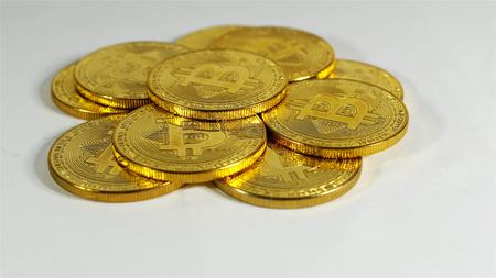 Rotating Stack Of Gold Bitcoins On Turntable.の写真素材
