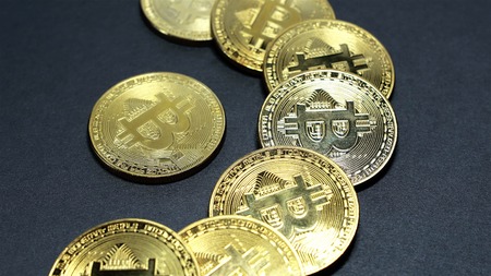 Rotating Stack Of Gold Bitcoins On Turntable.の写真素材