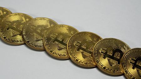 Rotating Stack Of Gold Bitcoins On Turntable.の写真素材