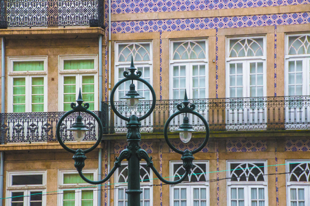 Facade of the building in Porto, Portuglia, decorated with multi-colored ceramic tiles azulejo.の写真素材