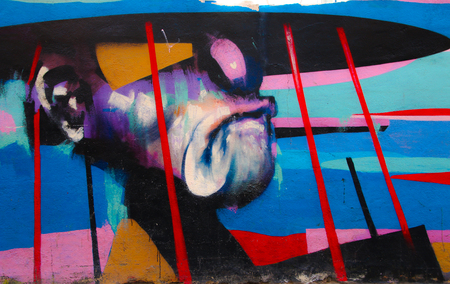 Valencia, Spain - January 2019: Colorful original graffiti on the wall of a building, street drawing, great background in a public place. Author unknownのeditorial素材