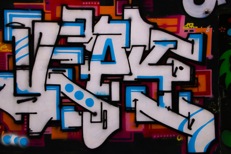Valencia, Spain - January 2019: Colorful original graffiti on the wall of a building, street drawing, great background in a public place. Author unknownのeditorial素材