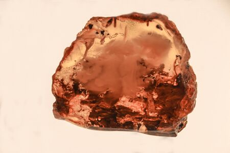 Fragments of amber close-up. Natural amber with pieces of antiquities insideの写真素材