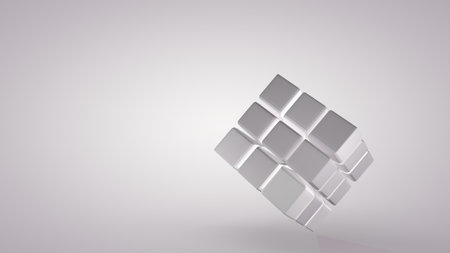 Rotation of the cube at an angle isolated on greyの写真素材