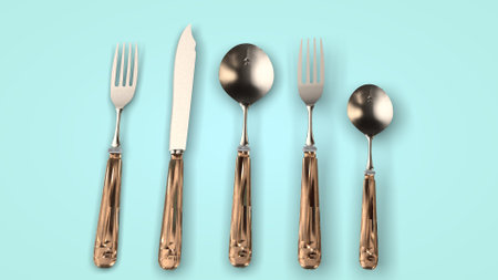Steel cutlery on greenの写真素材