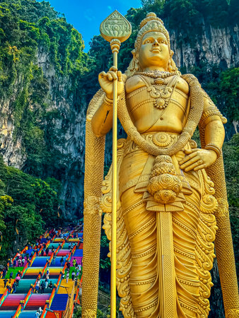 Batu Caves in Kuala Lumpur, golden statue of god Murugan.の写真素材