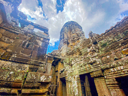 The three-level Mount Bayon Temple, a temple of the Khmer civilization, located on the territory of Angkor in Cambodia.の写真素材