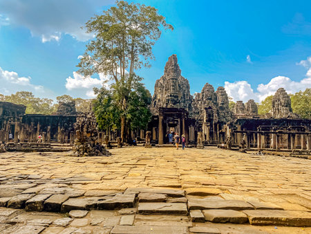 The three-level Mount Bayon Temple, a temple of the Khmer civilization, located on the territory of Angkor in Cambodia.の写真素材