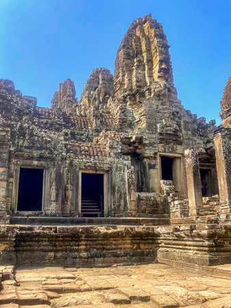 The three-level Mount Bayon Temple, a temple of the Khmer civilization, located on the territory of Angkor in Cambodia.の写真素材