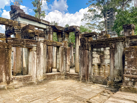 The three-level Mount Bayon Temple, a temple of the Khmer civilization, located on the territory of Angkor in Cambodia.の写真素材