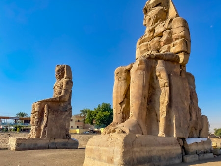 Colossi of Memnon, two massive stone statues representing the pharaoh, Luxor, Egypt.の写真素材